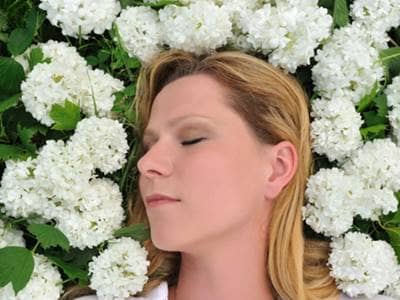 Woman in Bed of Flowers