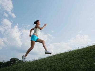 Woman running uphill