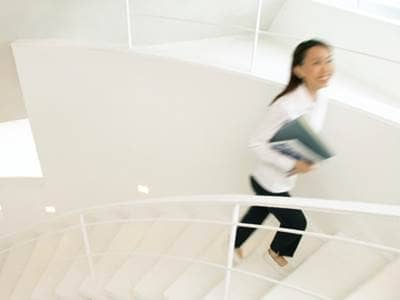 Woman Walking Up the Stairs