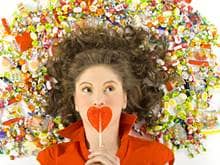 Heart lollipop and woman with candy surrounding her head