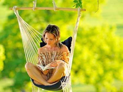 Woman reading in a hammock